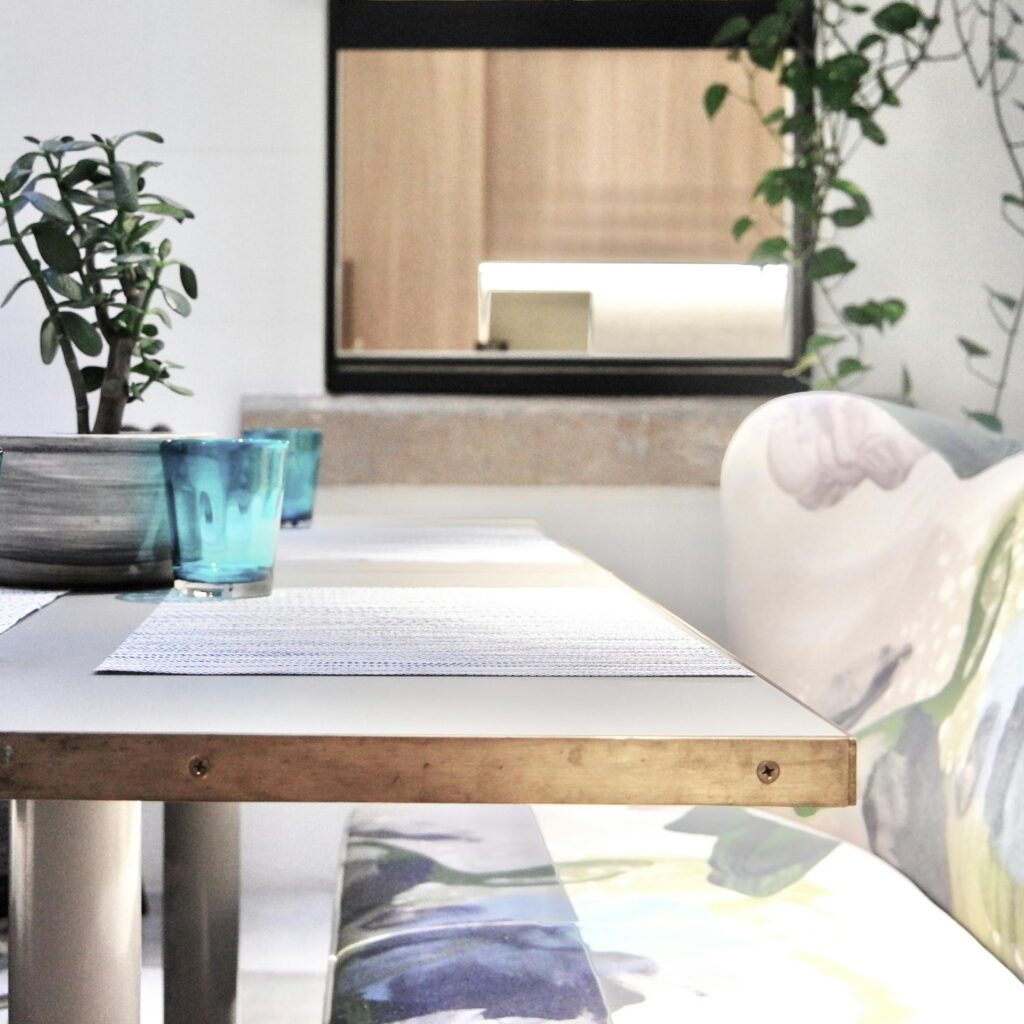 Contemporary dining area featuring potted plants and stylish decor.