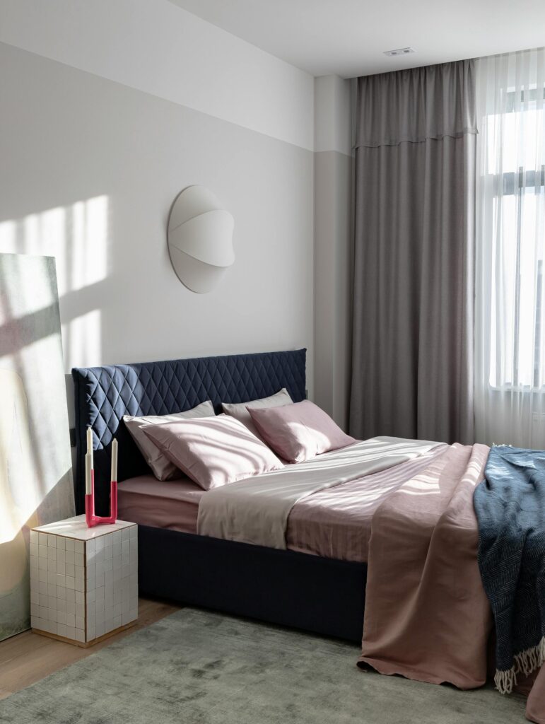 Elegantly designed bedroom featuring a modern and minimalist aesthetic.